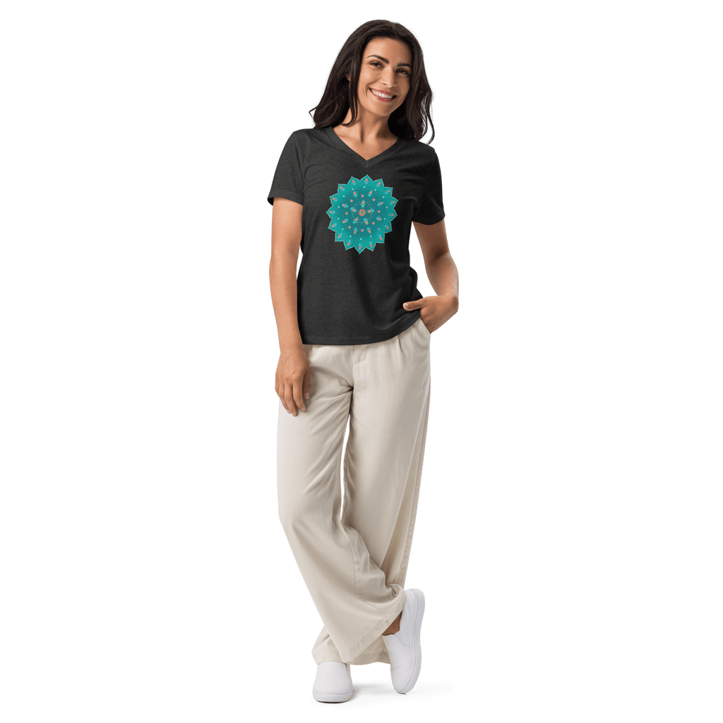 Woman wearing Teal Mandala Tee in black with white trousers 